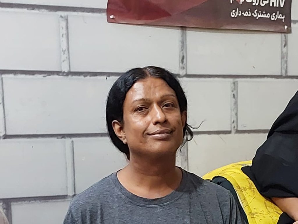 A participant smiling while completing a survey at a Degardis session